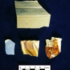 <p>Sherds of several types of 19th-century pottery found during the 2005-2006 archeological survey of Davids Island, including gray salt-glazed stoneware (top) and pearlware, redware with flat slip-trailing, and Rockingham-type yellowware (bottom, left to right).</p>